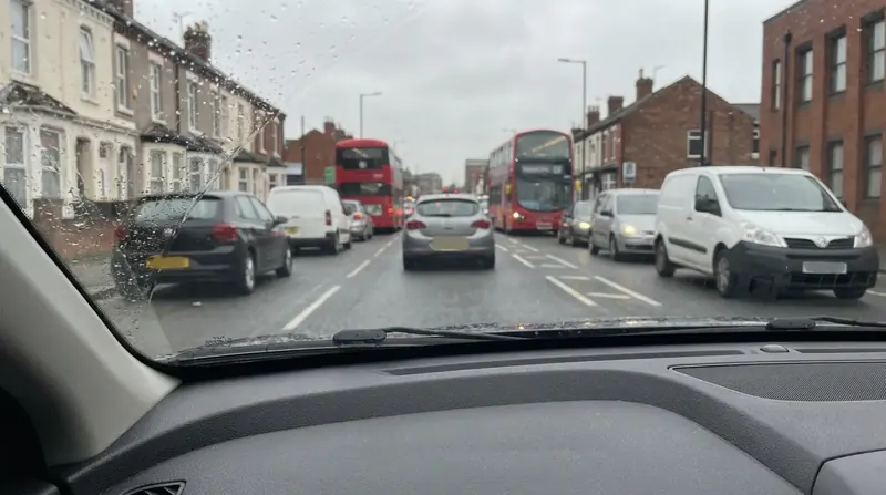 The view through a car windscreen of traffic on a road into central London
